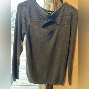 Medium sized dressier type sweater. Super soft, medium weight, and baggier fit.